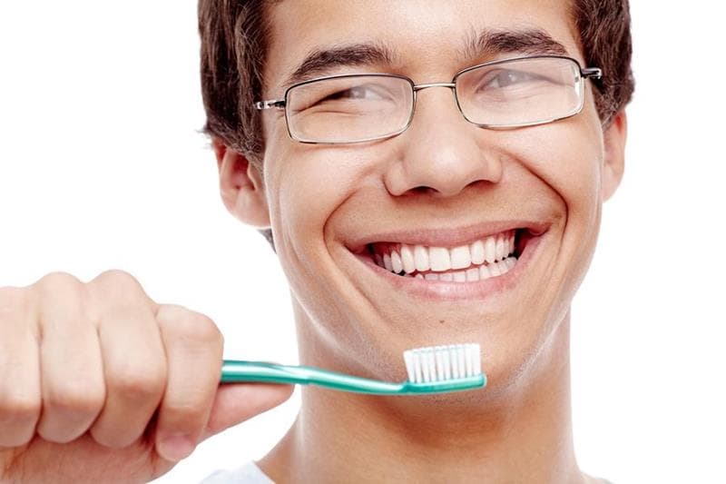 Patient brushing teeth
