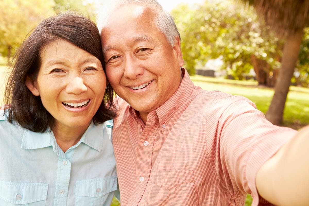 Smiling couple with dentures