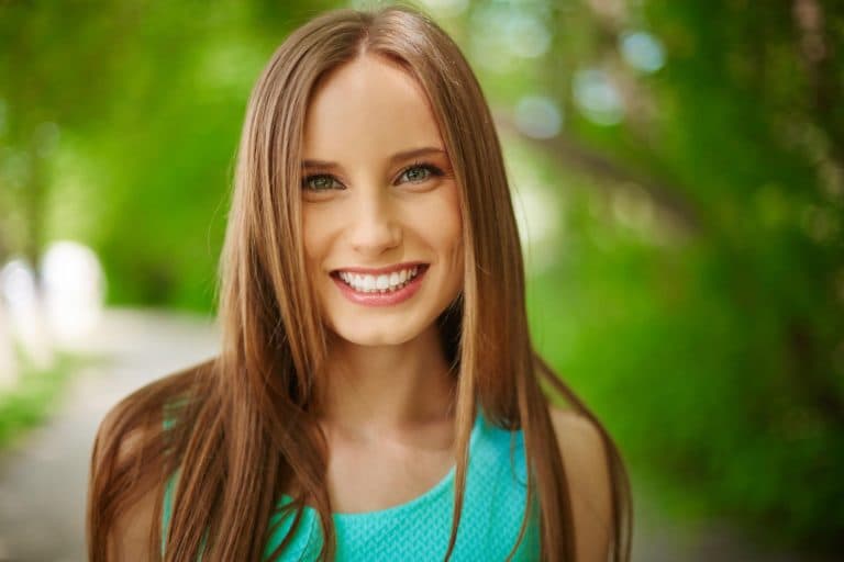 Young woman smiling outdoors